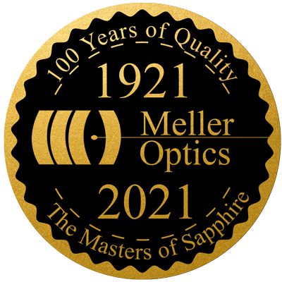 The Meller Optics 100th anniversary badge in gold.